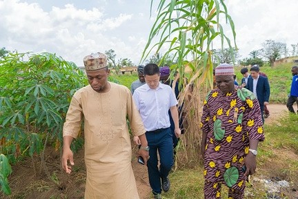 Officials walking a field site during a state assessment visit
